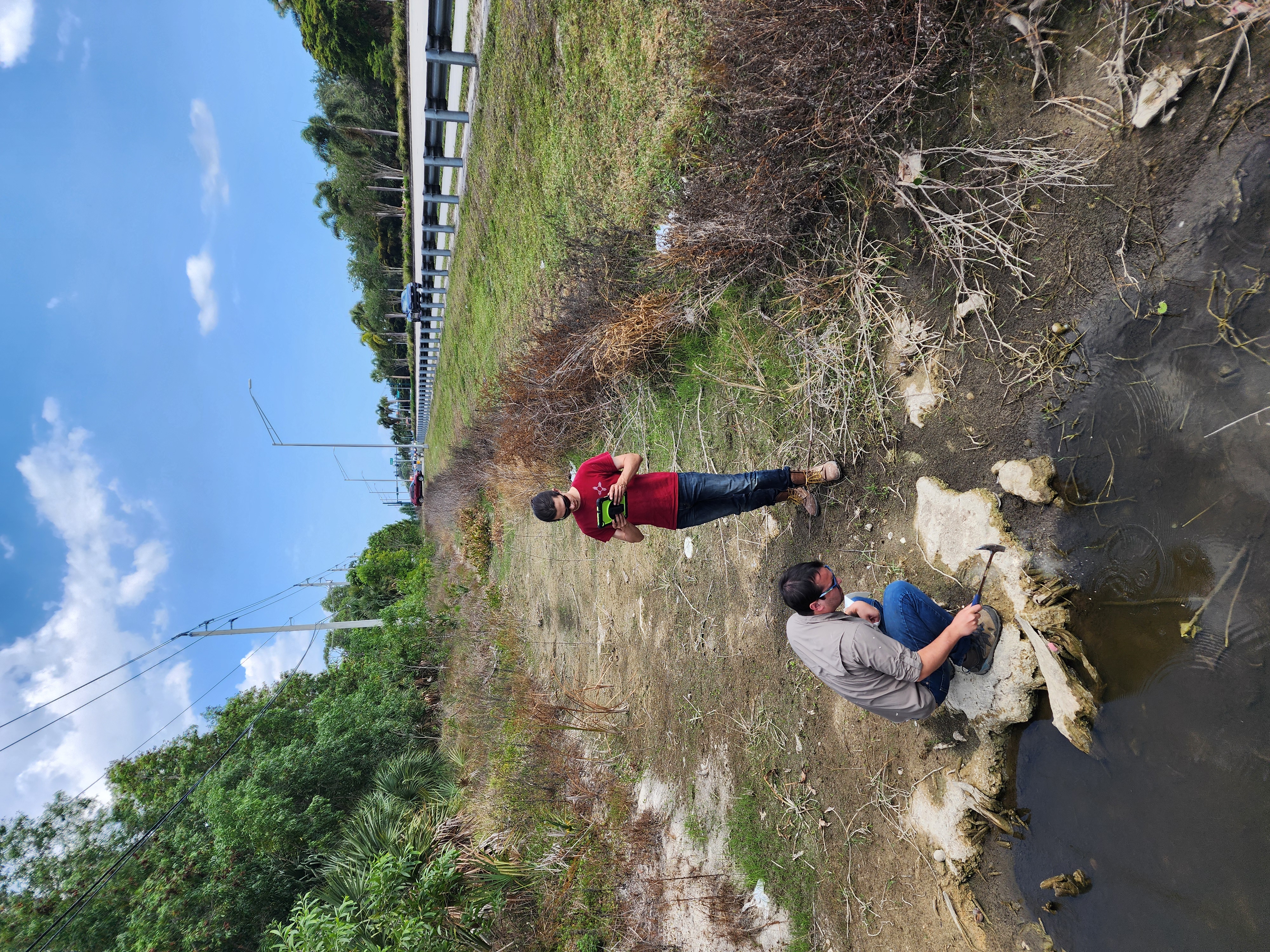 Geologists examining outcrop