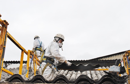 Asbestos workers removing roof