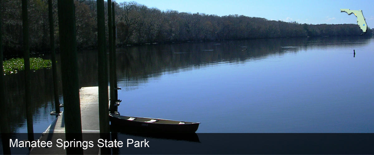 A canoe next to a floating dock on the river at Manatee Springs State Park in Dixie County, Florida