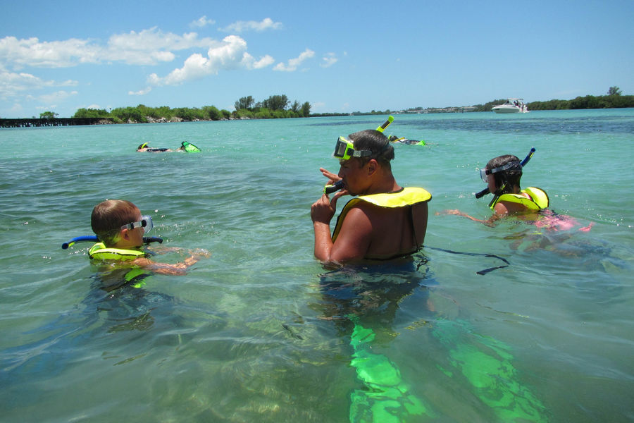 A family enjoys a snorkel eco-venture in Gasparilla Sound-Charlotte Harbor Aquatic Preserve