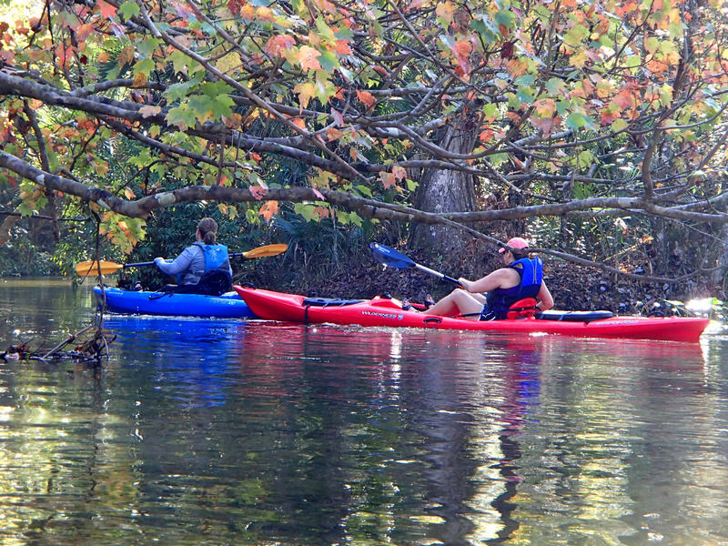 Two paddlers going down river at Rock Springs Run
