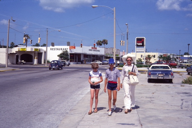 PEDESTRIANS IN DOWNTOWN DUNEDIN, FLORIDA IN THE EARLY 1980'S