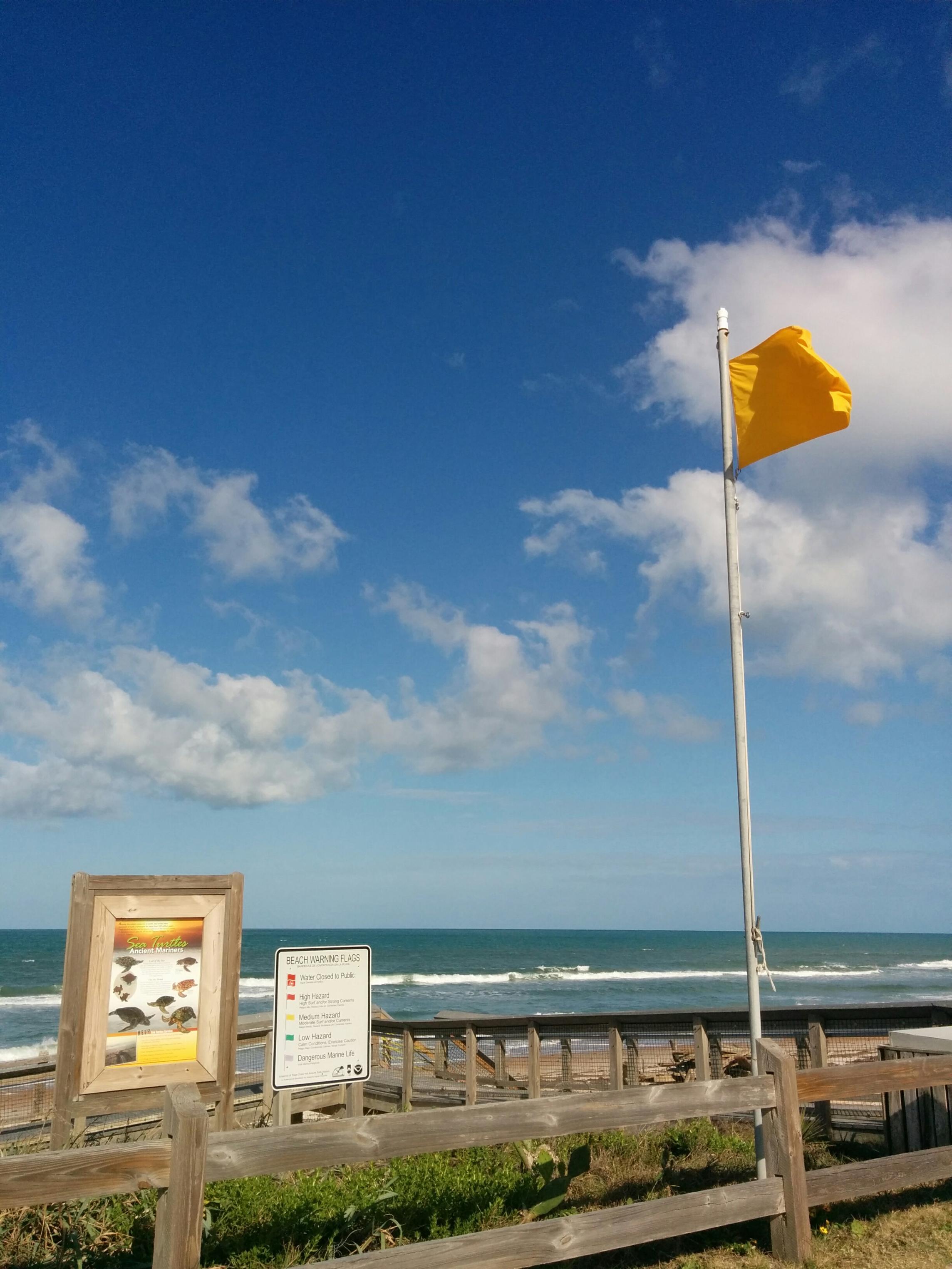 Beach Flag and Sign at a Beach Access Point near Ormand Beach, FL