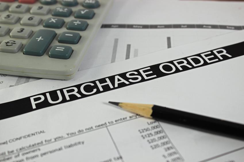 Purchase Order Form with Pencil and Calculator