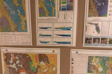 Interior wall showing geology maps and charts