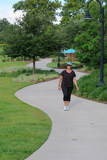 Laura Donaldson walks along paved trail